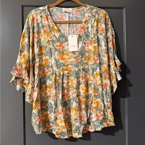 Pretty floral top by Emily Wonder
Size Small - runs large